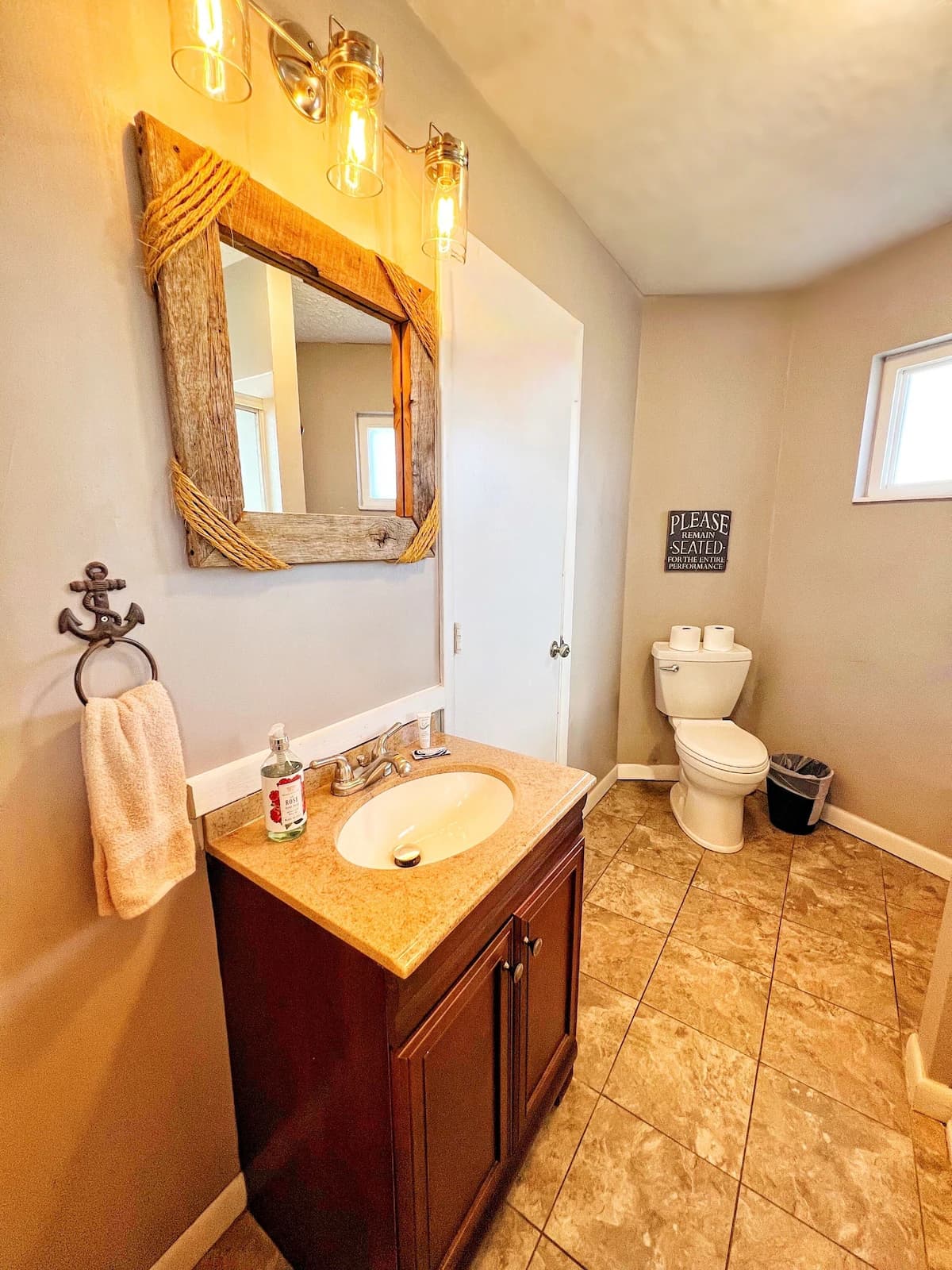 Bathroom with rustic wood-framed mirror